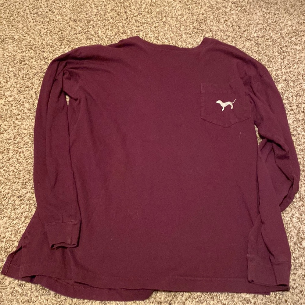 It’s a pretty and comfy shirt. It’s more Maroon that red. Has some cute designs